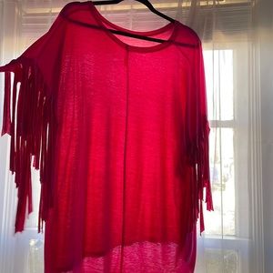 Pink fringe excellence condition fits a little big. Runs like Xl